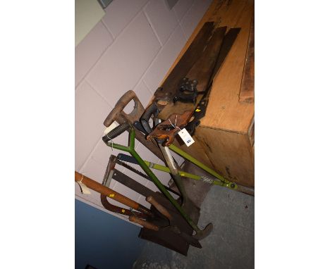 A large quantity of tools: hand saws; spades; etc.