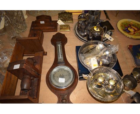 An oak barometer with chrome dial; together with oak book trough; bookends; pen tray; and a quantity of silver plated ware.