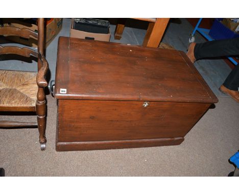 A stained wood carpenters trunk, the hinged top flanked by metal handles opening to reveal associated interior.
