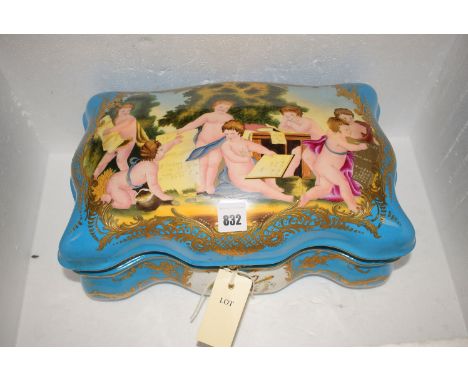 A large Sevres style ceramic box, the cover decorated in putti with gilded highlights on blue ground, the white interior with