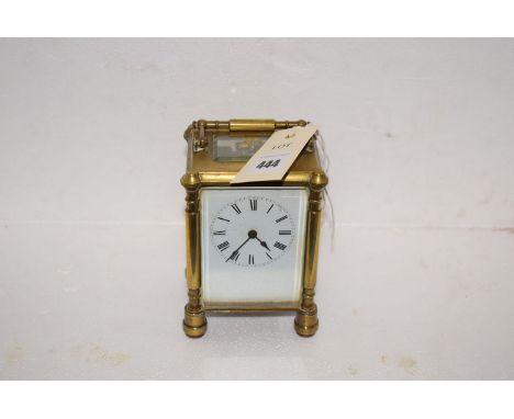A late 19th Century brass carriage clock with roman dial.