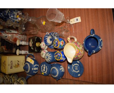 A collection of Wedgwood blue and white Jasperware; a pair of ceramic candlesticks; a pair of blue and white coffee cups and 