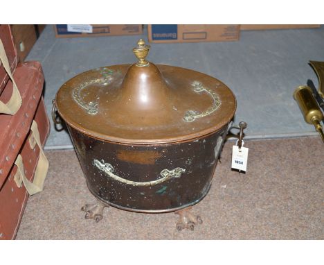 Copper coal scuttle with brass urn finial and swag mounts.
