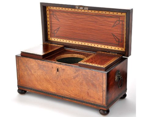An early 19th Century inlaid mahogany tea caddy, decorated throughout with rosewood crossbanding, ebony and boxwood stringing
