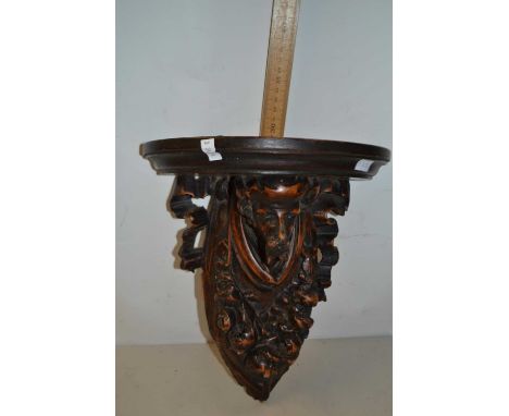 Continental carved 19th Century wall bracket, the support formed as a bearded figure