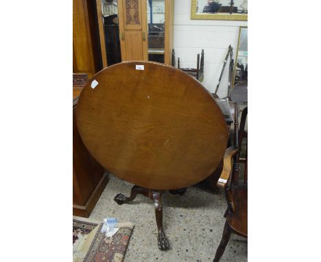 Mahogany circular top supper table raised on a turned column and tripod base with paw feet