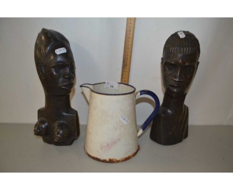 Pair of African wooden figures and an enamel jug