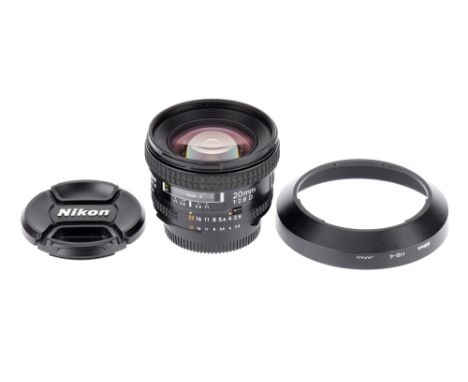 An AF Nikkor f/2.8 20mm Ultra Wide Angle Lens body VG, optics have light haze, with caps and hood