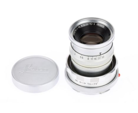 A Leitz Elmar f/4 9cm Lens, chrome, serial no. 1162585, body, VG, elements, F, with internal haze, with maker's front cap.
