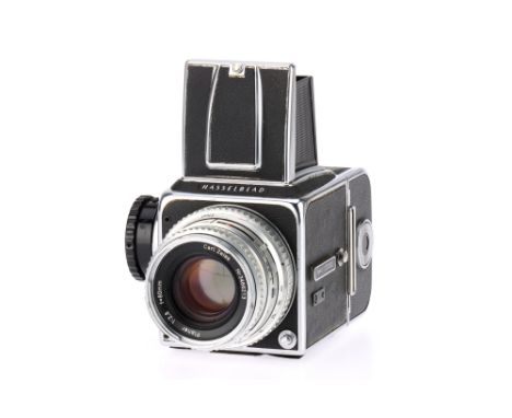 A Hasselblad 500C Medium Format Film Camera black, body F-G, leatherette lifting from base, shutter works, with a Carl Zeis P