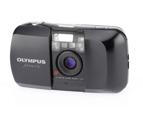 An Olympus mju-I 35mm Compact Film Camera black, f/3.5 35mm lens, body G, powers up, flash works shutter fires, film advances