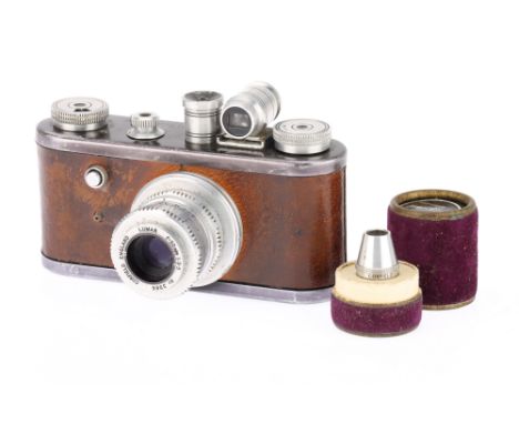 A Corfield Original Periflex 35mm Camera c1954, brown, black top and bottom plates, early model with name engraved on top pla