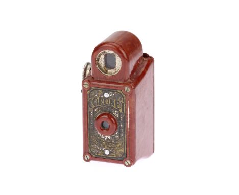 A Red Corronet Midget Subminiature Camera, red, in F-G condition, some light corrosion throughout, shutter working, no obviou