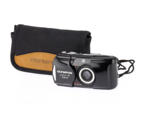 An Olympus mju-II zoom 80 35mm Compact Camera body G, 38-80mm zoom lens, powers up with battery inserted, takes a photo, flas