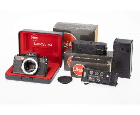 A Leica R4 35mm SLR Camera Body, Data Back and Motor Drive, black, serial number 1567525, body G, shutter works when batterie