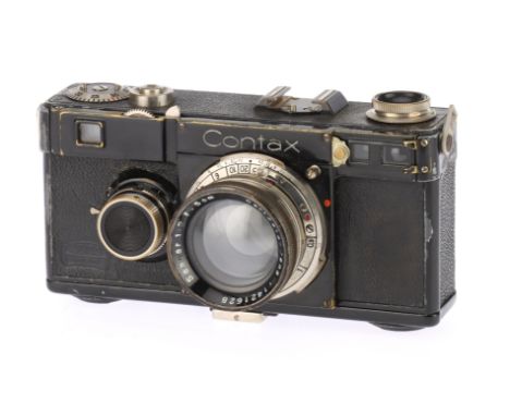A Contax Ic 35mm Rangefinder Camera, black, body F-G, shutter is working but slow speeds spurious, RF patch is clear, togethe