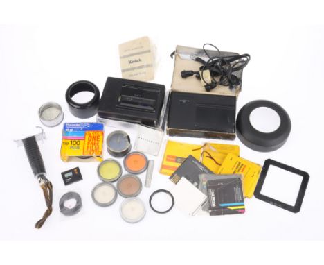 A Selection of Hasselblad Accessories, to include a Polaroid film backs, gel filters, a set of Carl Zeiss Proxar lenses, circ