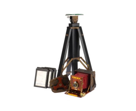 A Sanderson Junior Hand and Stand Half Plate Camera, black leather, body F-G, red bellows, extend but not light tested, with 