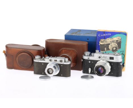 A Pair of FED Rangefinder Cameras, comprising a FED 1, silver, serial number 33990, shutter works but second curtain is slow,