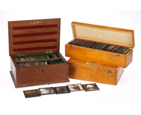 A Mixed Selection of Cased Magic Lantern Slides, to include three cases, the first containing a range of commercial slides of