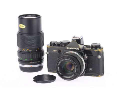 An Olympus OM2N 35mm SLR Camera, black, body F-G, some paint wear and brassing, shutter needs attention, works but has small 