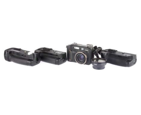 Three Battery Grips &amp; a Casio Camera, to include three third-party battery grips, together with a Casio QV-4000, for part