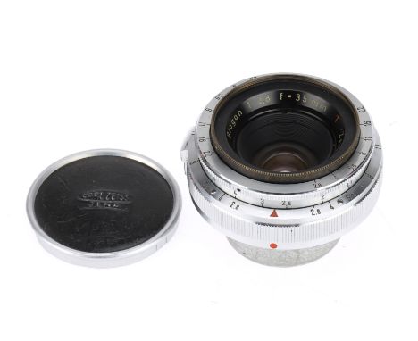 A Zeiss-Opton Biogon T f/2.8 35mm Camera Lens silver, serial 579351, barrel G, optics G with light dust, with metal front cap