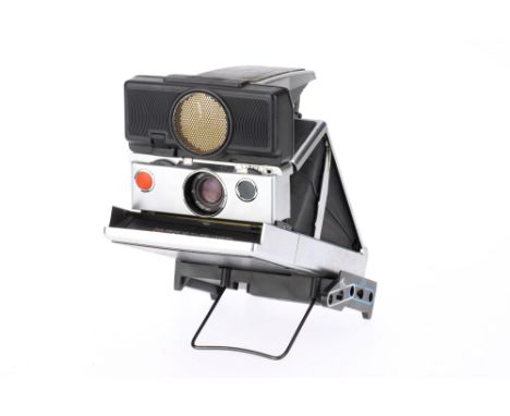 A Polaroid SX-70 Sonar Land Camera body G, some usage marks to top cover, opens and locks in place, otherwise untested.