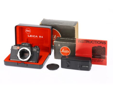 A Leica R4 35mm SLR Camera Body black, body G, light marks to lens mount, with batteries inserted all shutter speeds work and