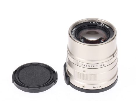 A Carl Zeiss Sonnar T* f/2.8 90mm Lens titanium colour, serial no.7919898, made in Japan, for Contax G, body VG-E, optics G, 