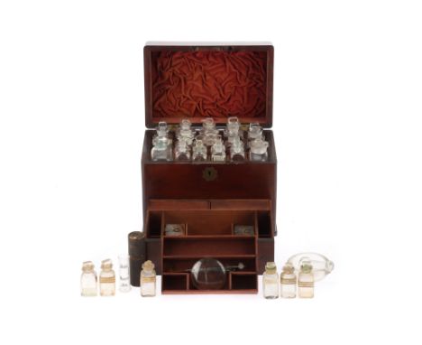 A 19th Century Domestic Medicine Chest, English, mahogany trunk-type chest with brass fittings, ruched plush-lining to the li
