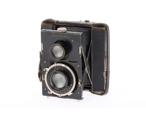 A Bentzin Primarette Twin Lens Viewfinder Camera, black, body F, some paint wear and usage marks to leather, both bellows ext