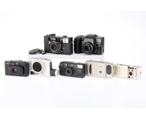 A Selection of Compact Cameras to include a Konica z-Up 80, untested, a Canon Dial 35, untested, a Cosina CX-2, powers up, a 