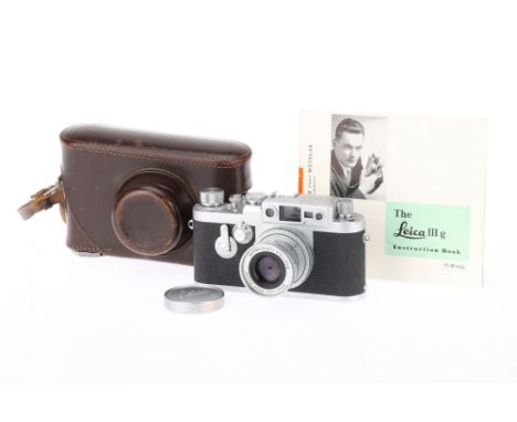 A Leica IIIg 35mm Rangefinder Camera, silver, serial number 879030, body VG, light marks to bottom plate, shutter works, rang