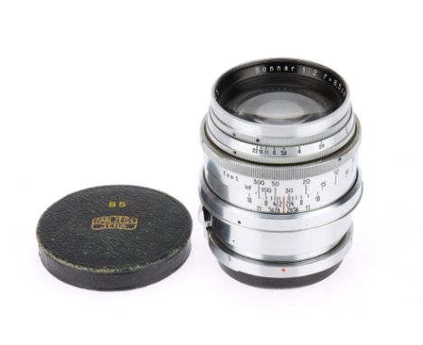 A Carl Zeiss Jena Sonnar f/2 8.5cm Camera Lens chrome, serial 2232425, barrel G, optics G with hase and light fungus, with ca