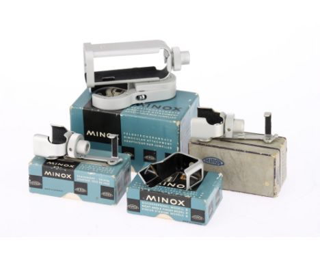 A Small Selection of Minox Accessories to include a binocular attachment, a right angle finder and two tripod adapters, in bo
