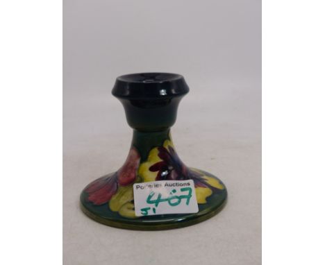 Moorcroft Hibiscus pattern candle stick together with Anenome Triangular ash tray &amp; An orchid pattern octagonal ash tray 