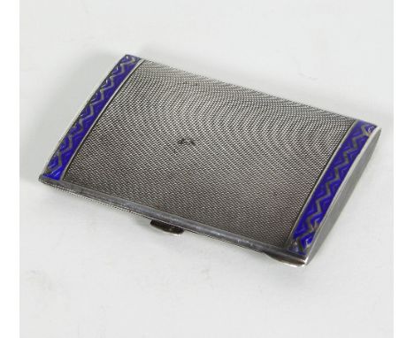A silver engine turned cigarette case, import marks London 1926, with blue enamel border, approximately 90gm