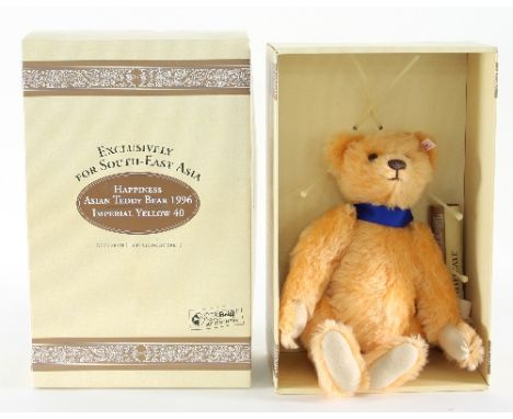 A Margarete Steiff limited edition teddy bear, 'Happiness Asian Teddy Bear 1996' in Imperial yellow, edition of 3000 exclusiv