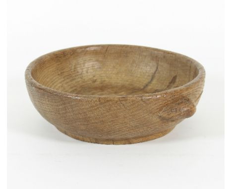 Robert 'Mouseman' Thompson (British 1876-1955): An oak bowl of circular plain form carved with a mouse to the outer body, 23c