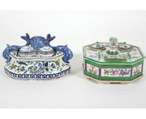 A Gien faience inkstand, with shell and dolphin surmount, fitted two inkwells and covers, 21cm wide and a Paris porcelain des