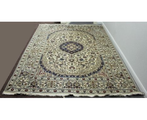 A modern Persian style rug, the central lavender medallion on an ivory ground within a foliate border, 295cm x 202cm