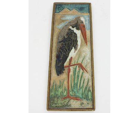 A Royal Delft earthenware tile, decorated a tube lined stork in the manner of Walter Crane, 32cm x 12cm Condition Report: Ove