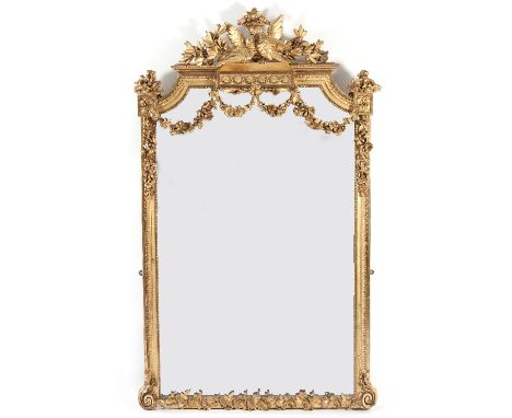 A mid 19th Century gilt gesso wall mirror, with ornate pediment depicting a pair of courting doves amongst laurel leaves abov