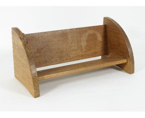 Robert 'Mouseman' Thompson (British 1876-1955): An oak book trough with a mouse to one edge, 46cm wide/see illustration