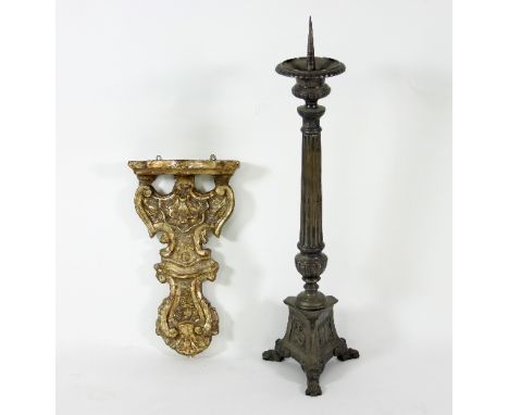 A gilt plaster wall bracket with scroll support, 50cm high and a pricket candlestick of Carolean design, 86cm high