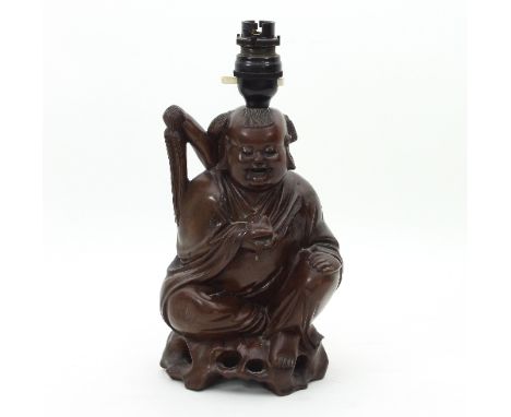 A Chinese carved hardwood figure of Pu-Tai, 23cm high, adapted as a lamp