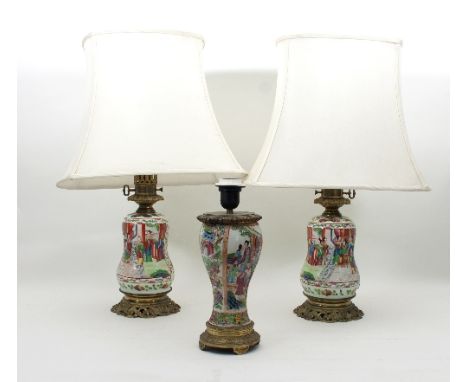 A pair of Cantonese gourd shaped lamps, painted figures in interiors and garden landscapes, with gilt metal mounts, complete 