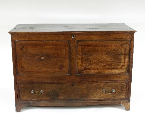 An oak mule chest, the hinged cover crossbanded in mahogany above a panelled front with single drawer under on bracket feet, 