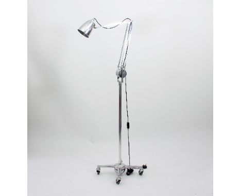 A Hadrill and Horstmann chrome counterpoise floor standing lamp on four-castor trolley base, stamped Hadrill & Horstmann Ltd,